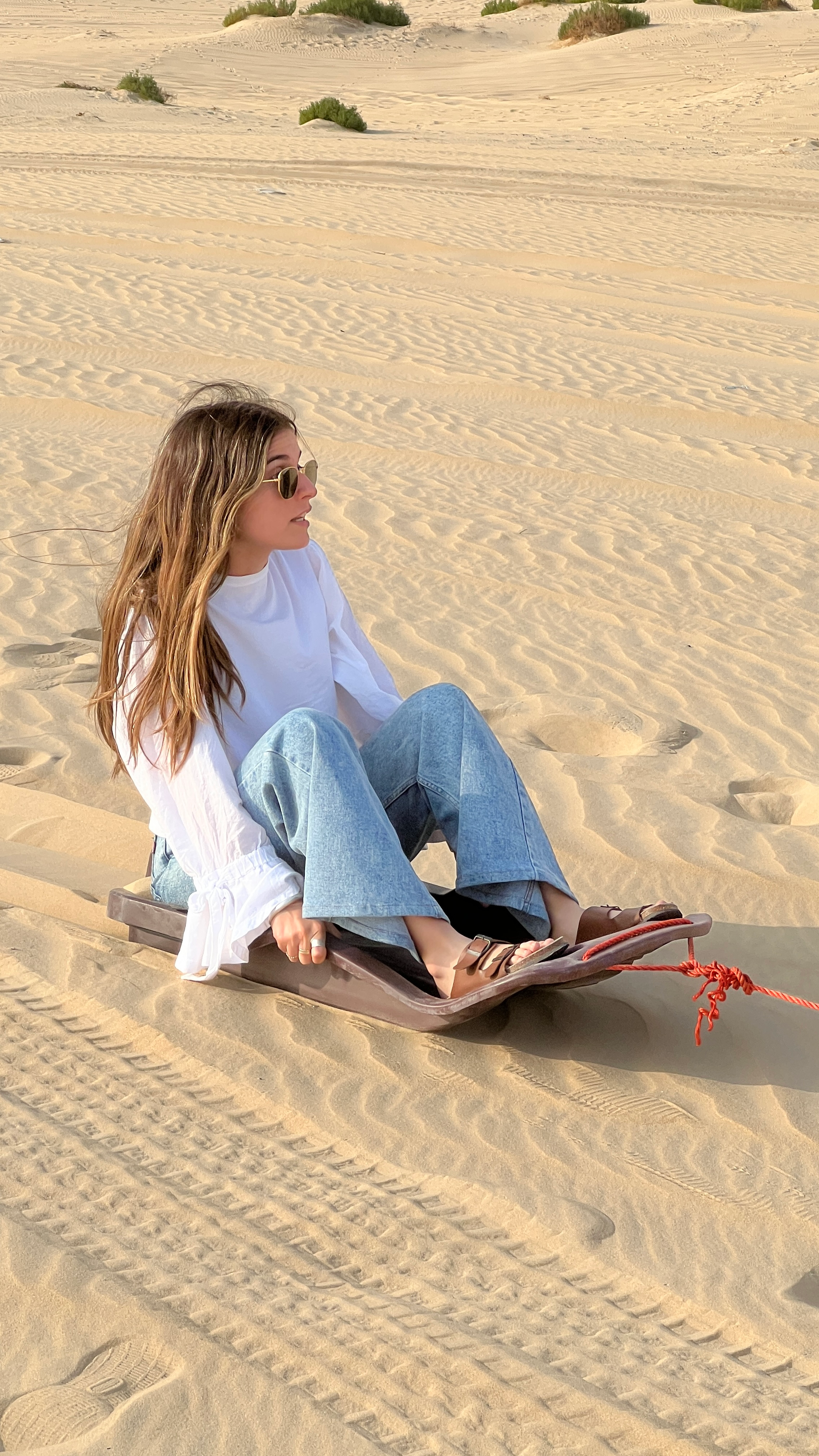 Sandboarding during a desert safari in Dammam