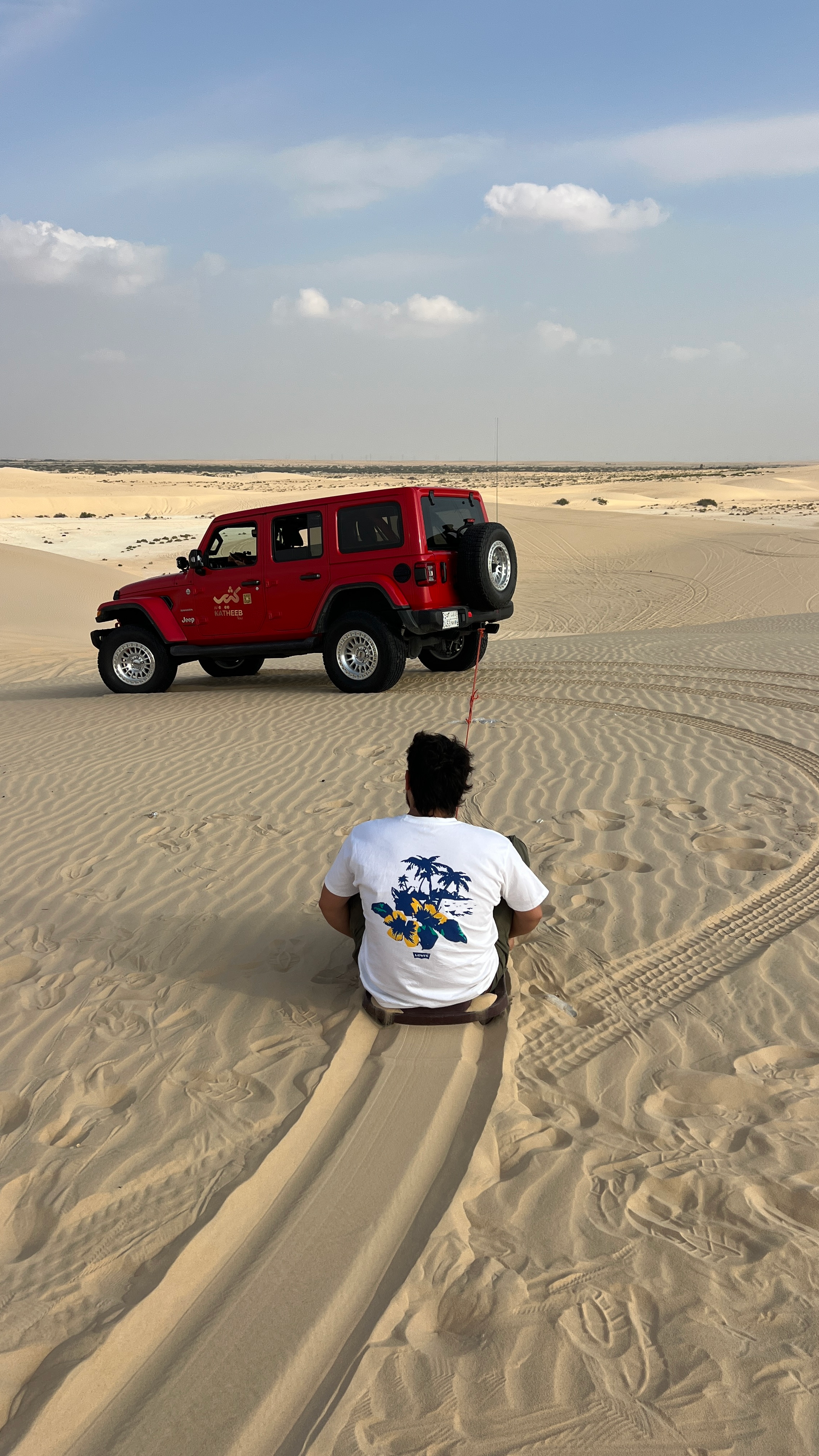 Sandboarding during a desert safari in Dammam